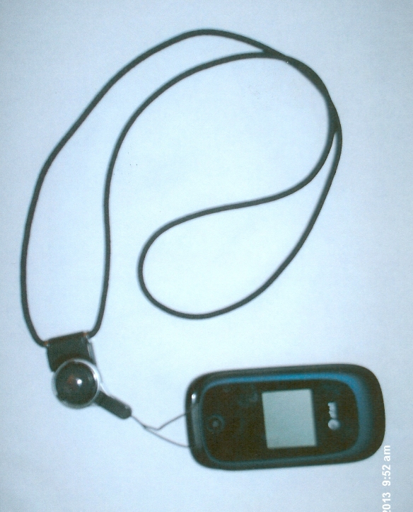 Lanyard attached to closed clamshell cell phone