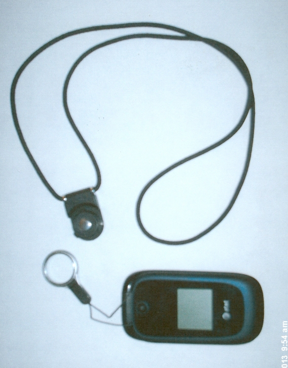 Cell phone detached from pendant-style lanyard